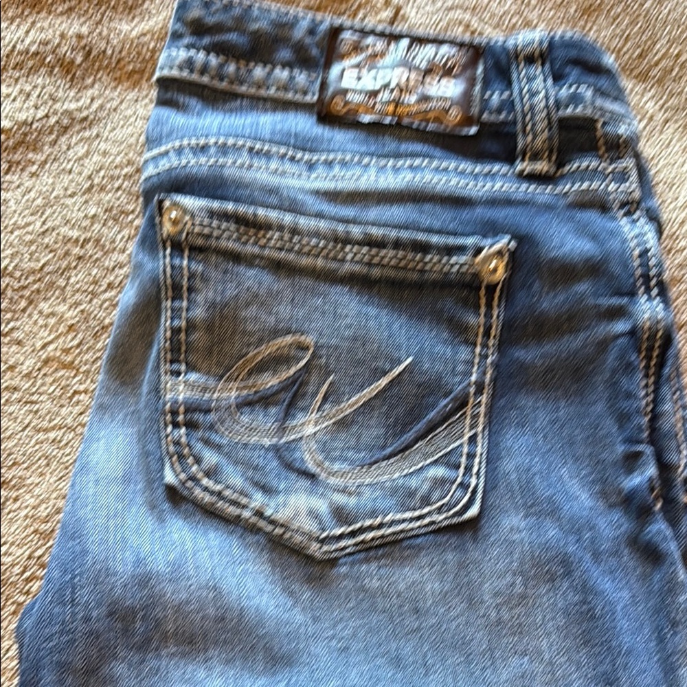 Express Blue Jeans with Decorative Stitching and Natural Fading